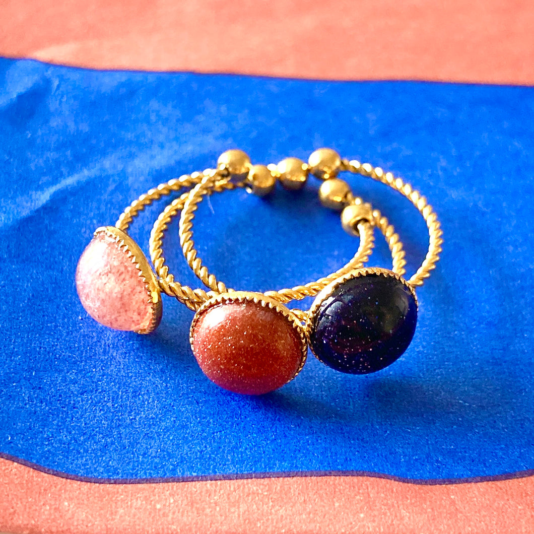 Bague en acier doré et pierres