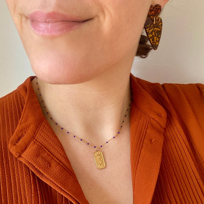 Collier astre en acier doré