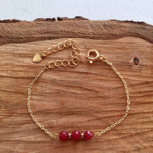 Bracelet doré et jade rouge